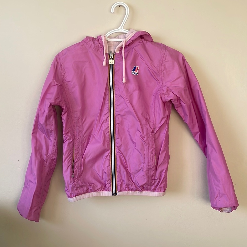 Reversible pink and baby pink K-Way jacket.